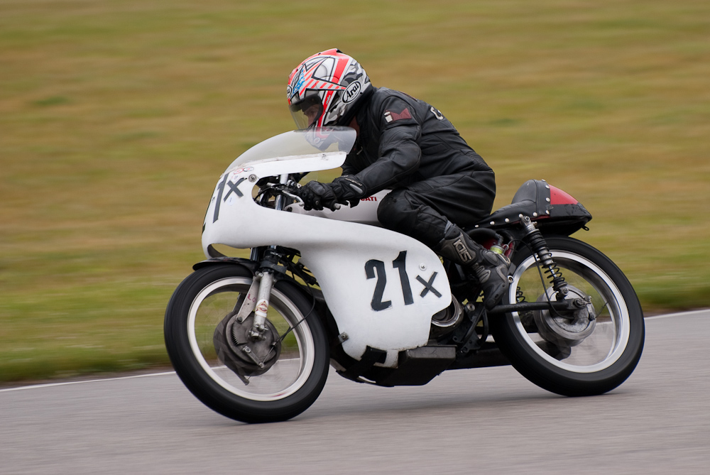 Larry Poons on a 1965 Ducati, No 21X in the bend, Road America, Elkhart Lake, WI 