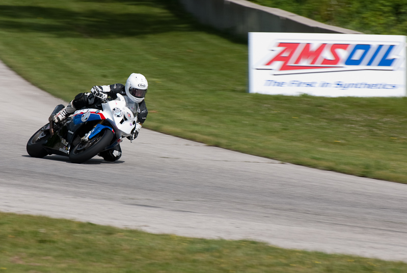 Eric Pinson, No.2 on the Blue Moon Liberty Waves BMW S1000RR in turn 13, Road America, Elkhart Lake, WI