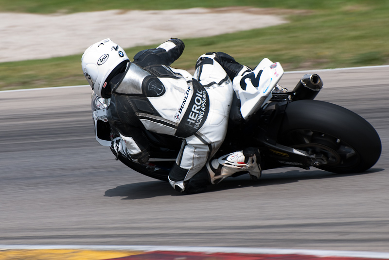 Eric Pinson, No.2 on the Blue Moon Liberty Waves BMW S1000RR in turn 6, Road America, Elkhart Lake, WI