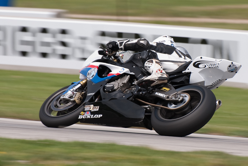 Eric Pinson, No.2 on the Blue Moon Liberty Waves BMW S1000RR in turn 7, Road America, Elkhart Lake, WI