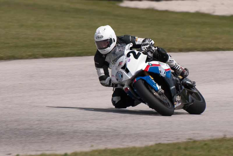 Eric Pinson, No.2 on the Blue Moon Liberty Waves BMW S1000RR in turn 7, Road America, Elkhart Lake, WI