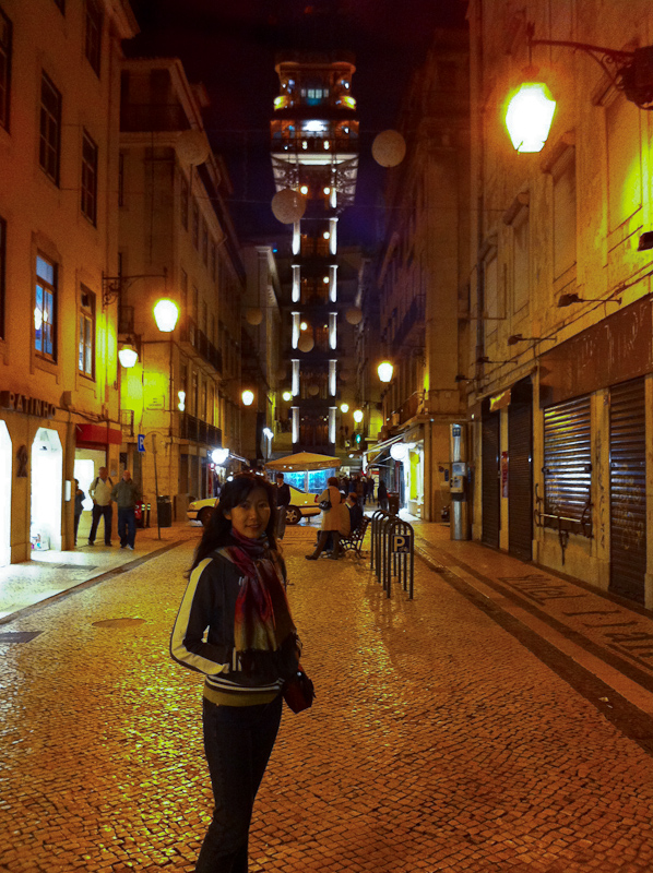 Lisbon streets at night with Elevador de Santa Justa in the background. - iPhone4 photo